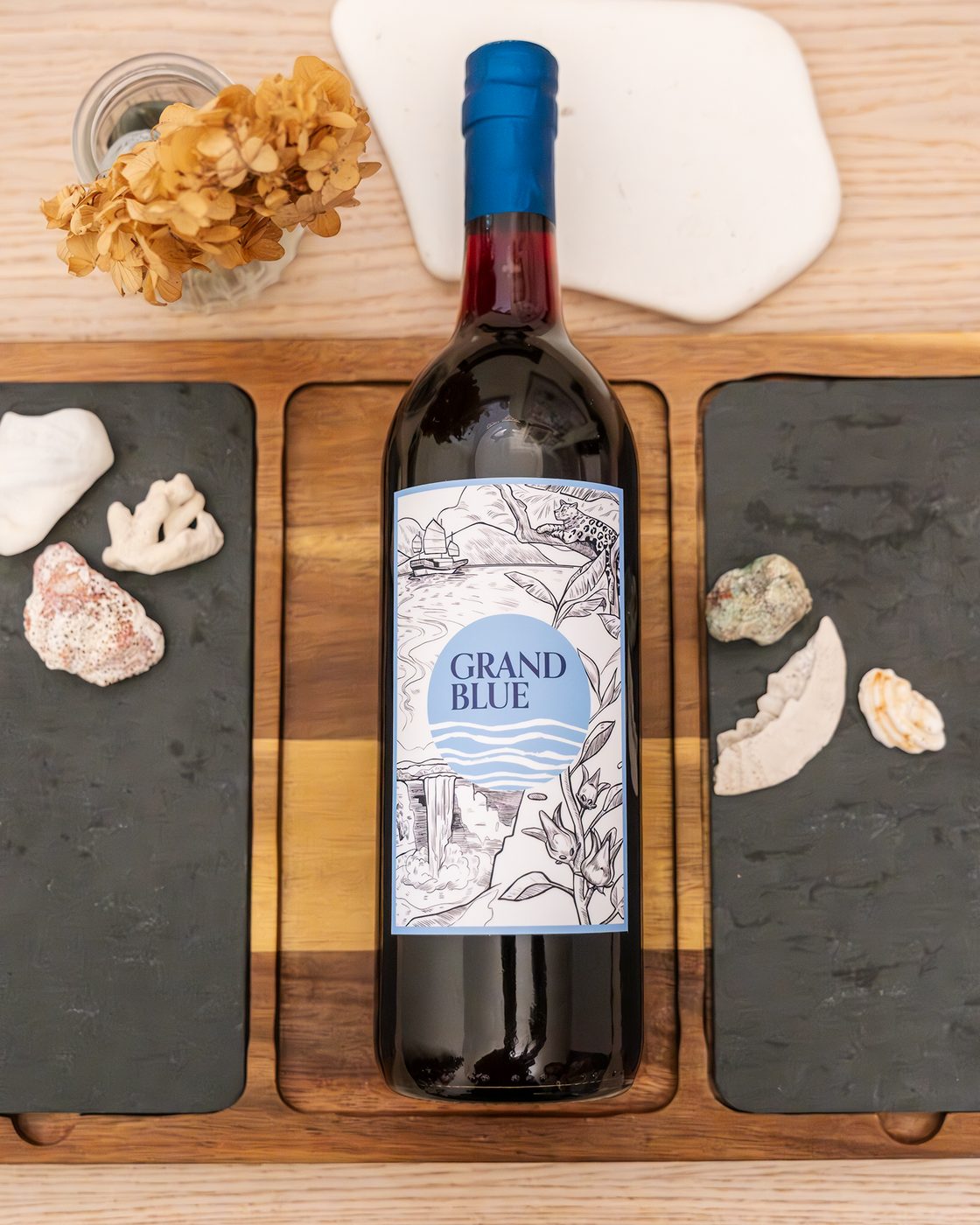 Grand Blue sorrel bottle on a wooden tabletop