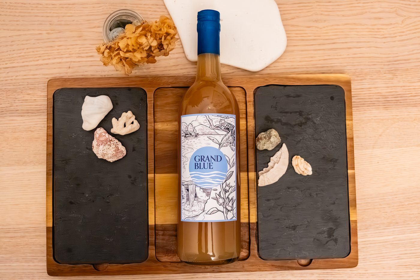 Grand Blue ginger beer bottle on a wooden tabletop